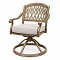 Sedia girevole in alluminio e rattan con cuscino in tessuto